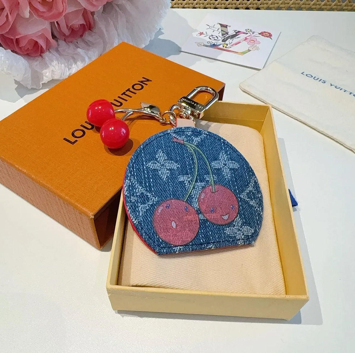 Luxury Denim Cherry Mirror Keychain with iconic cherry design and functional mirror, a premium accessory. - Hình 4