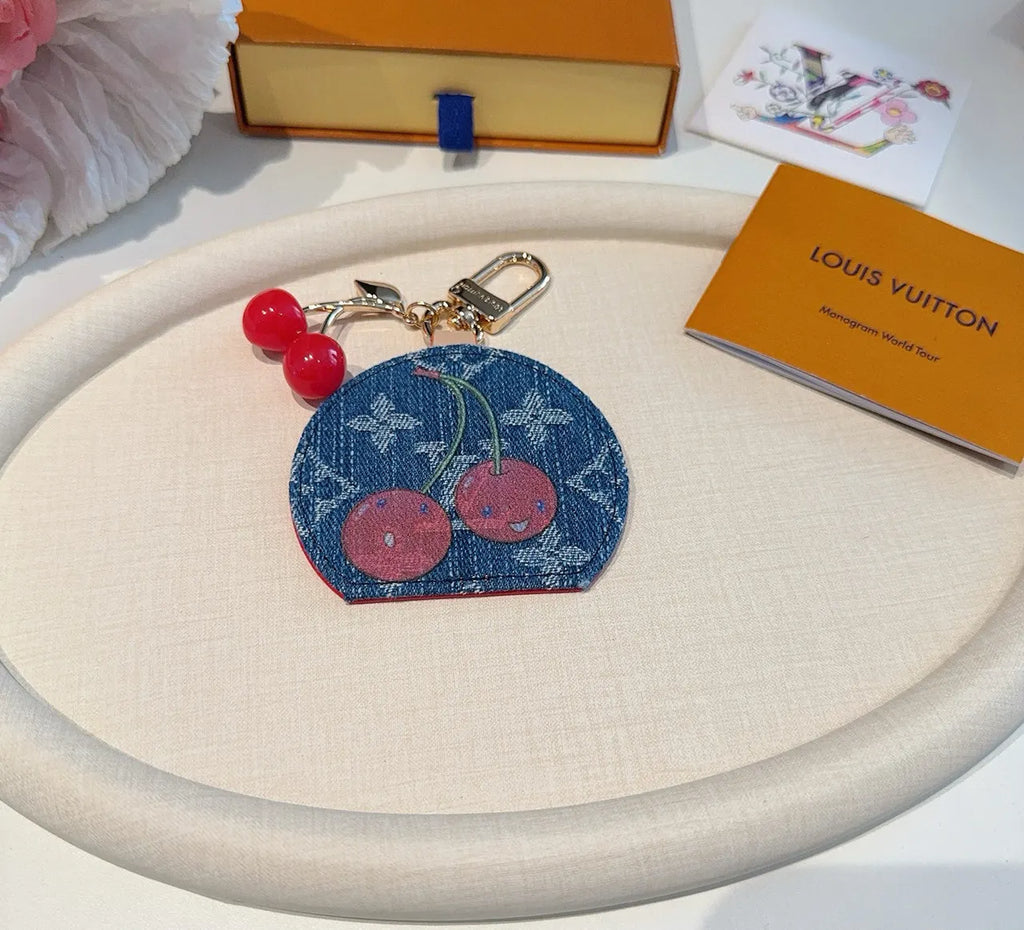 Luxury Denim Cherry Mirror Keychain with iconic cherry design and functional mirror, a premium accessory. - Hình 5