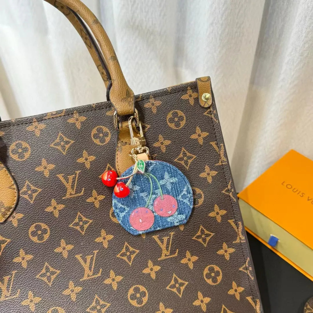 Luxury Denim Cherry Mirror Keychain with iconic cherry design and functional mirror, a premium accessory. - Hình 7