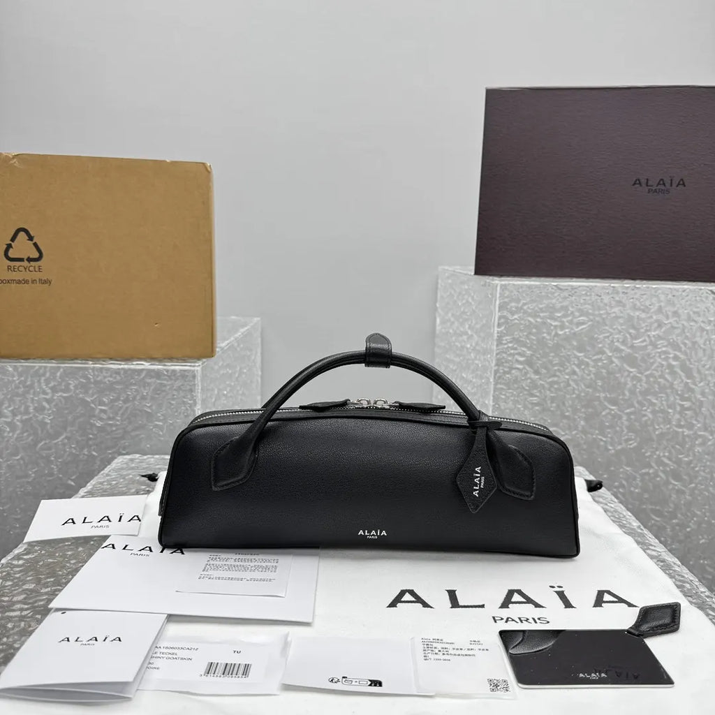 sleek Alaïa Black Leather Cylinder Bag