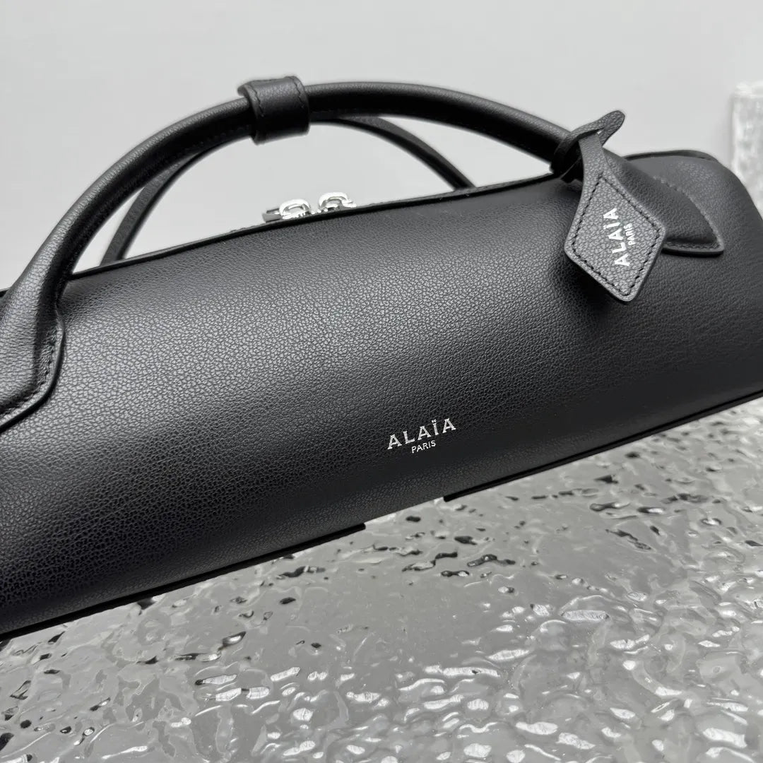 sleek Alaïa Black Leather Cylinder Bag - Hình 4