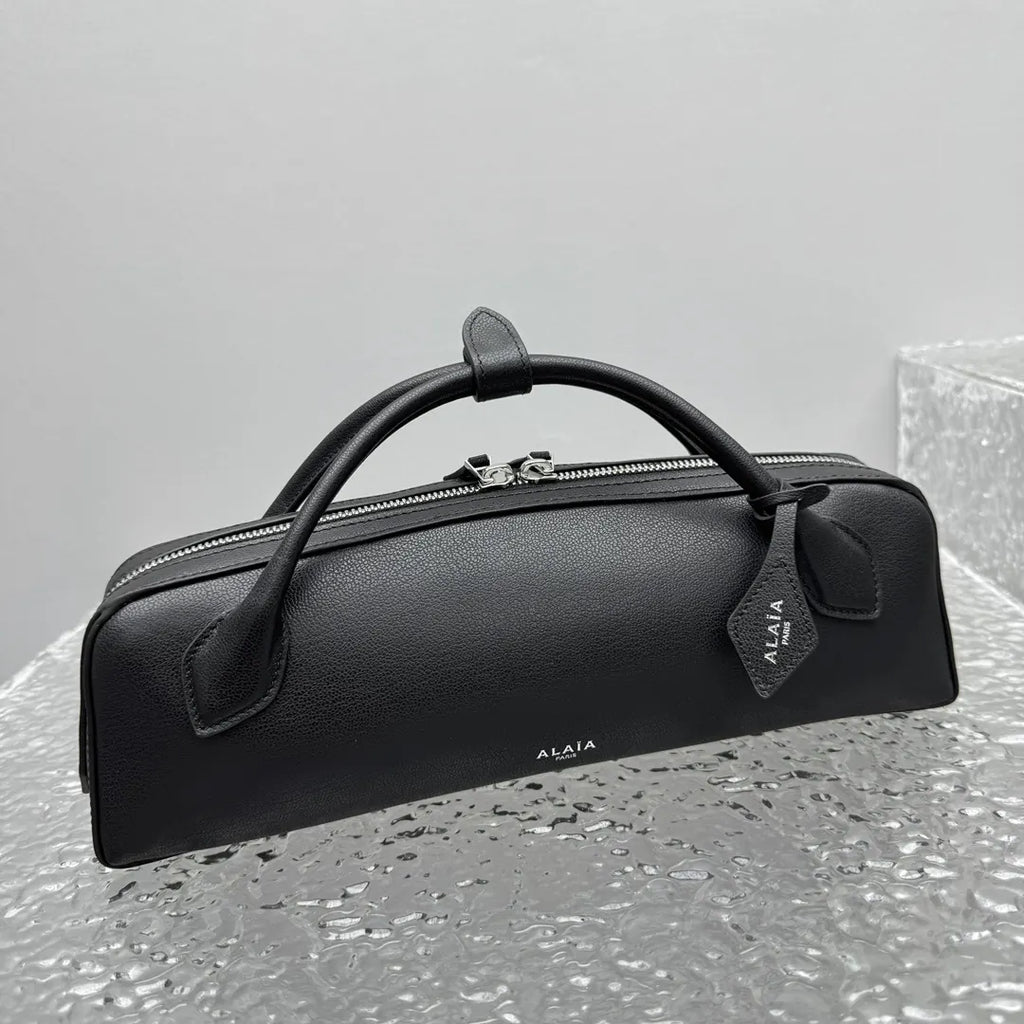 sleek Alaïa Black Leather Cylinder Bag - Hình 5