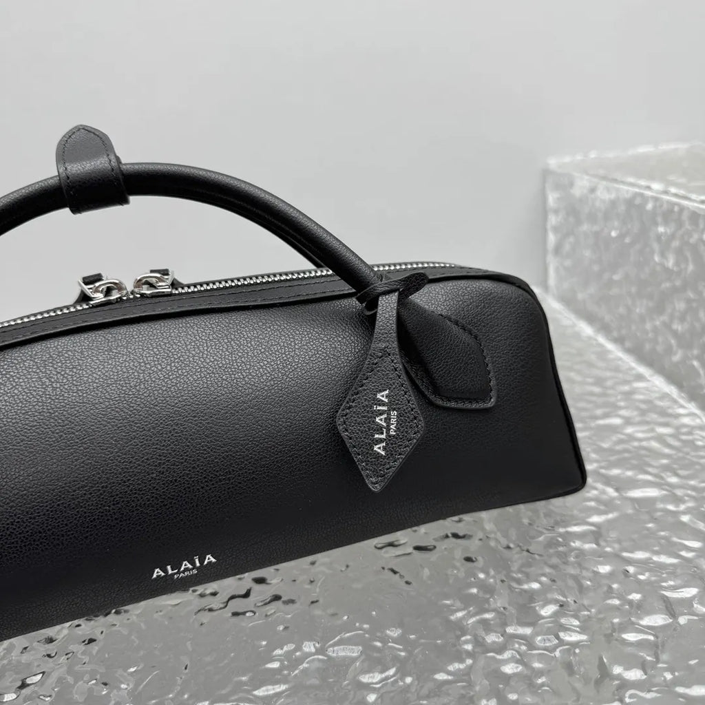 sleek Alaïa Black Leather Cylinder Bag - Hình 10