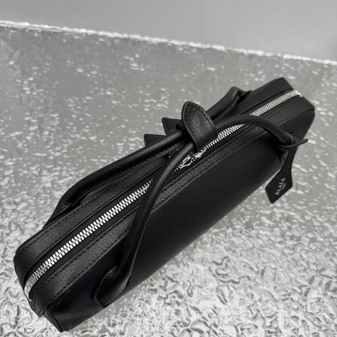 sleek Alaïa Black Leather Cylinder Bag - Hình 11