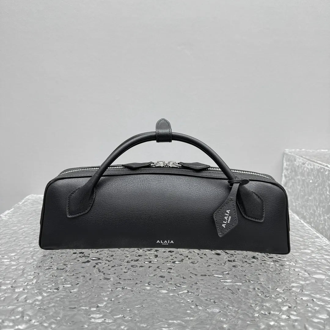 sleek Alaïa Black Leather Cylinder Bag - Hình 7