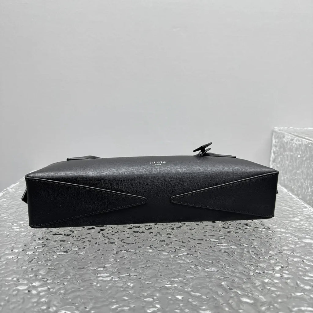 sleek Alaïa Black Leather Cylinder Bag - Hình 9