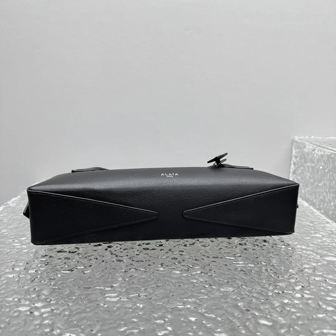 sleek Alaïa Black Leather Cylinder Bag - Hình 9
